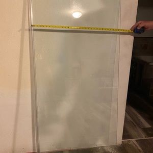 Stationary shower door.
